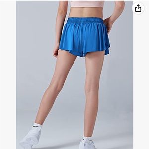 Blue butterfly shorts, tags still on, size YS